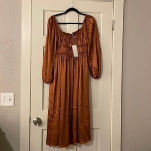 LUSH Pines Satin Drawstring Pocketed MIDI Dress in Cognac Bronze color.